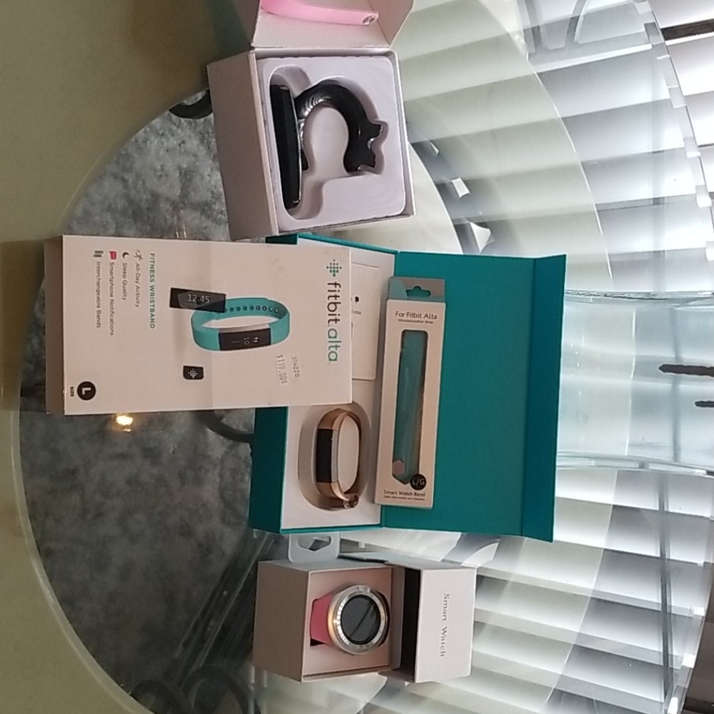 Fitbit Alta and Smart watch. Bonus charger.
